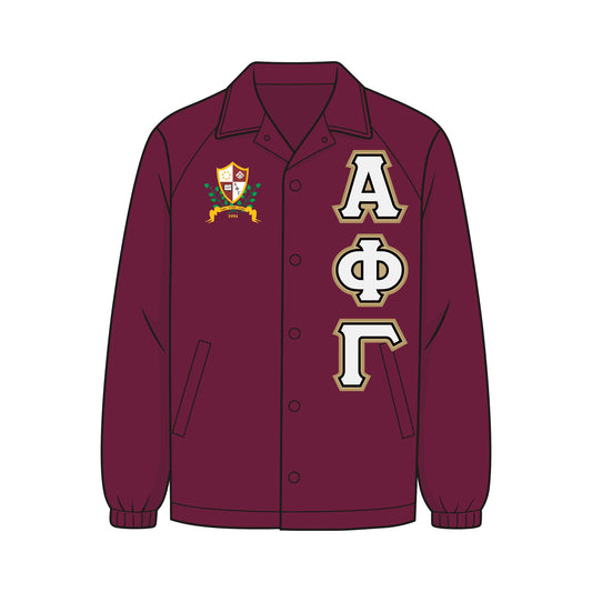Custom Alpha Phi Gamma line jacket. Jacket is a maroon coach jacket. The APhiG crest is on the right chest. Light gold, white, and black APhiG fabric applique letters are on the left chest. Alpha Phi Gamma Sorority, Inc. is an Asian‑interest sorority founded at California State Polytechnic University, Pomona on February 1, 1994.